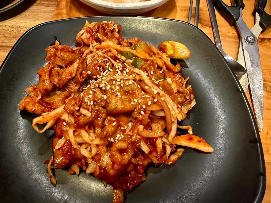 Fire-grilled octopus stir-fry with added cheese