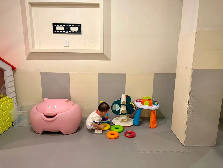 Kids' room set up with play-house toys