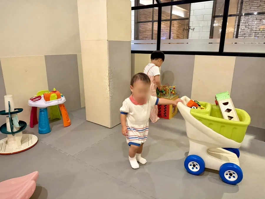 A child playing in the kids' room