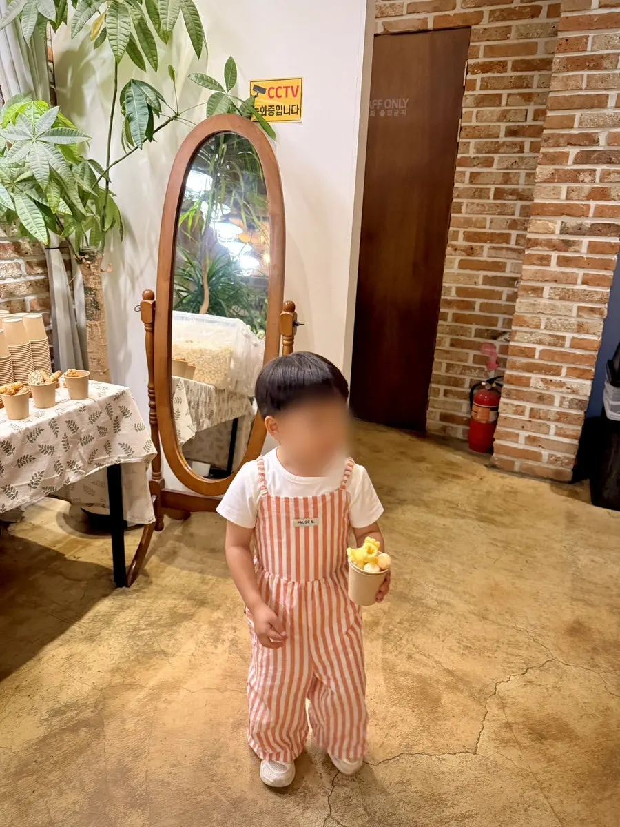 A cup of dessert snacks a child filled themselves