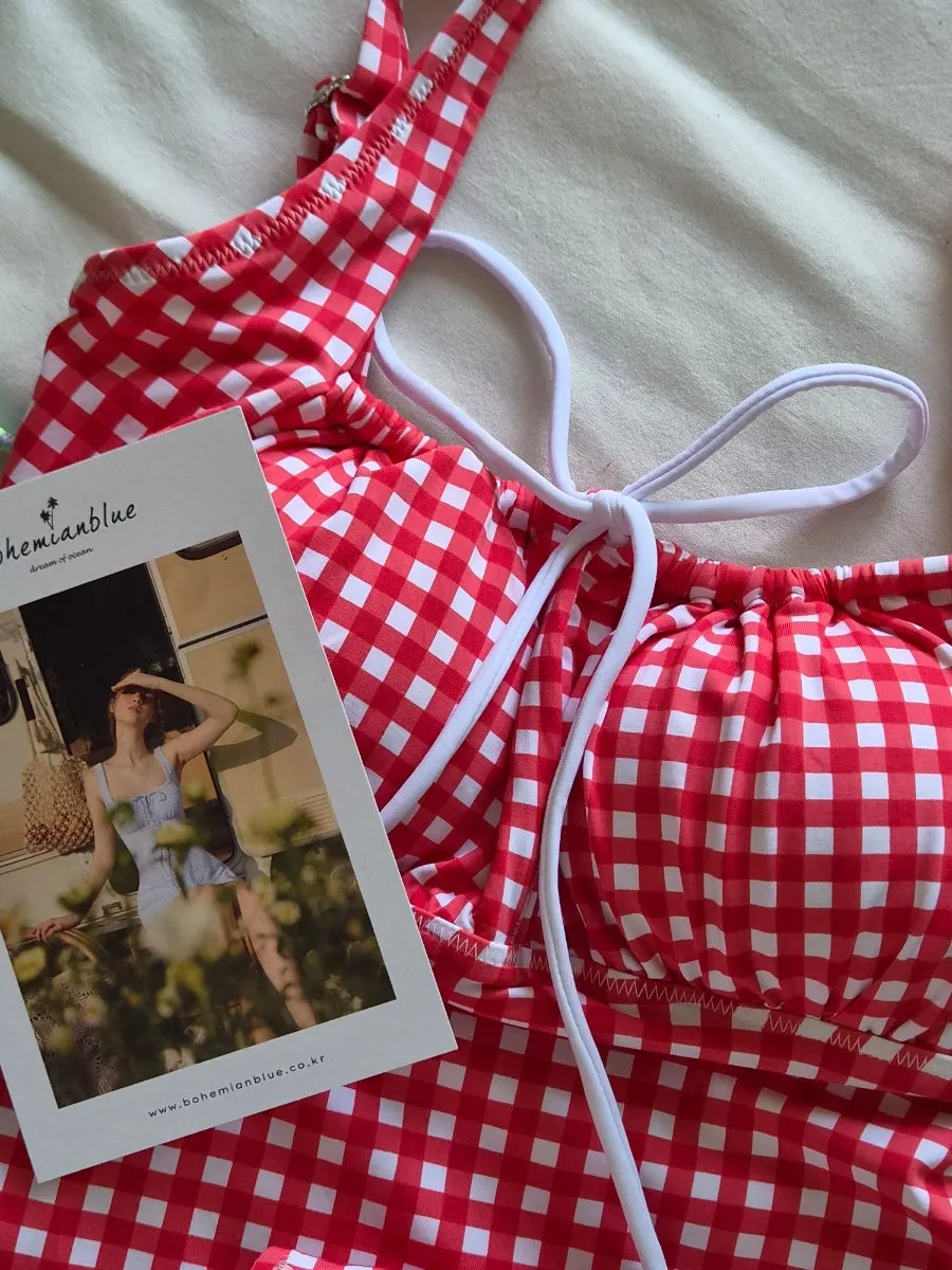 Postcard and storage pouch received with the one-piece swimsuit