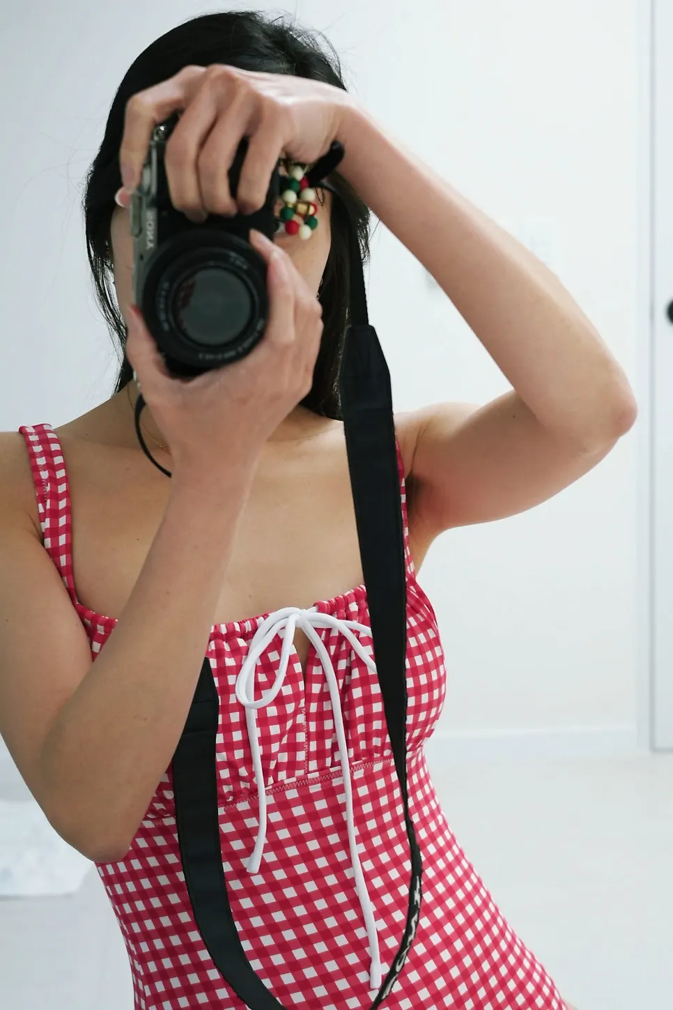 Bohemian Blue check swimsuit worn at a pool villa