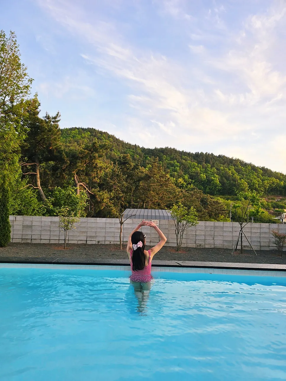 Check one-piece swimsuit with an adjustable bow fit