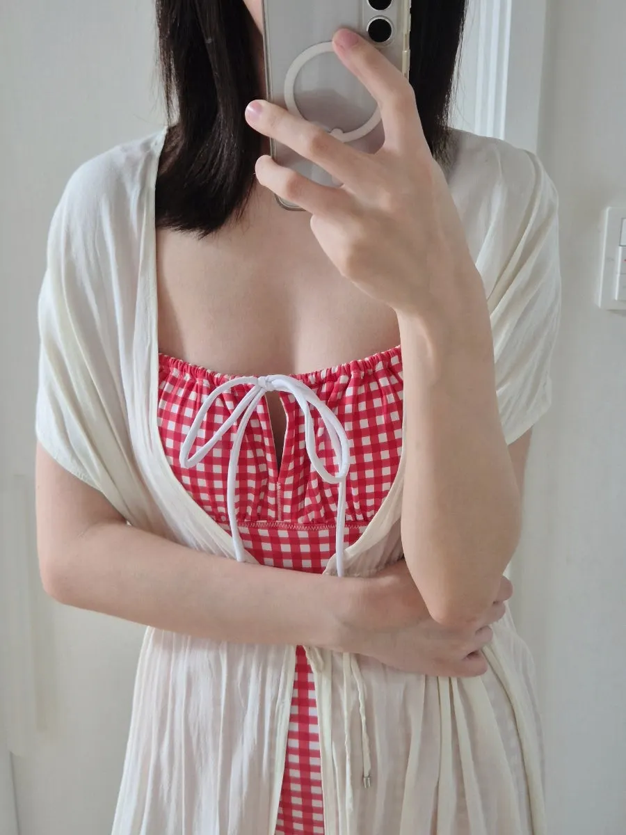 Checked one-piece swimsuit with a bow and shirring