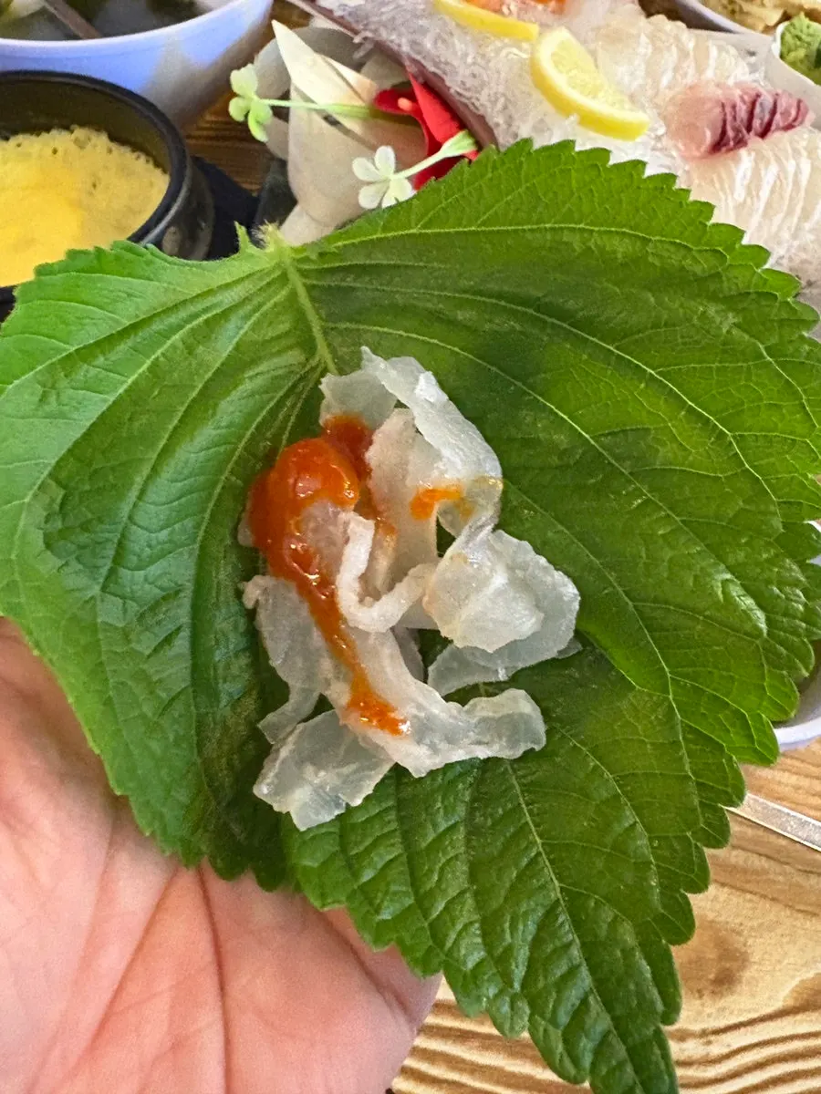 Picking up a piece of squid fritter