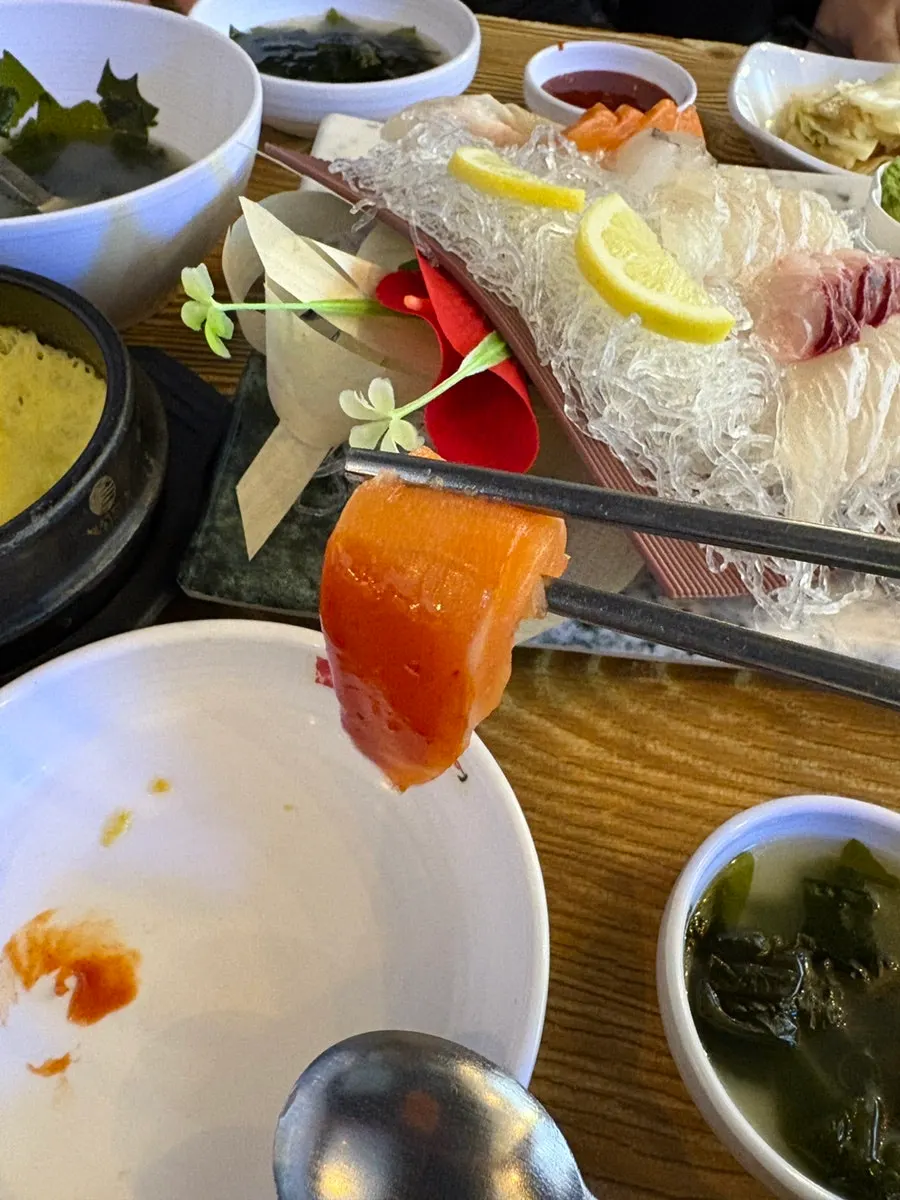 Table setting with sashimi and wrap vegetables