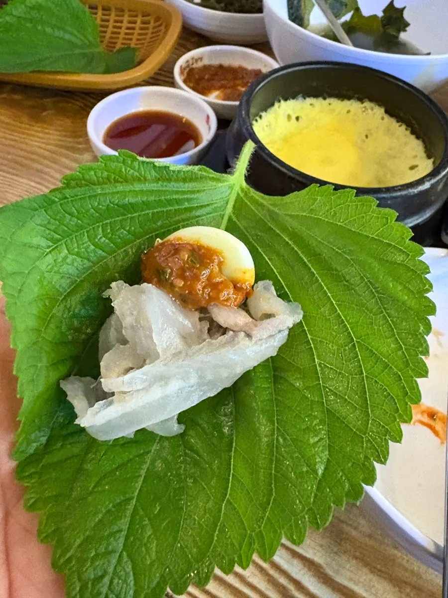 A piece of sashimi prepared for wrapping