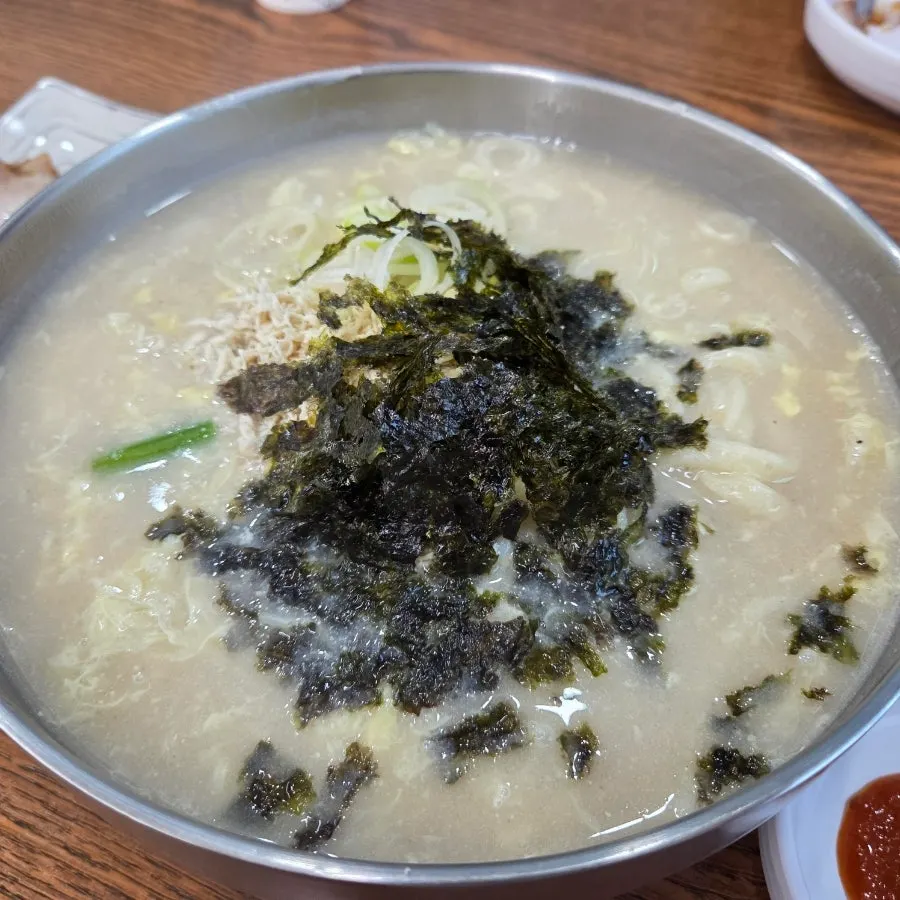 Cheongdam Dak Kalguksu served in a stainless steel bowl
