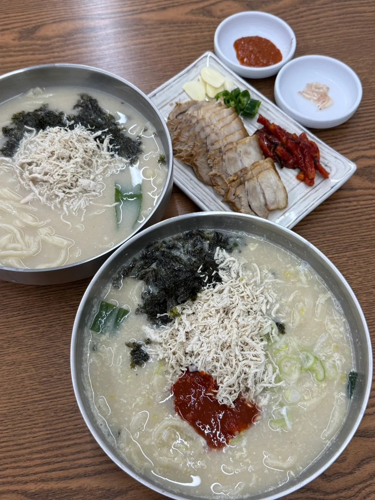 A bowl of spicy chicken kalguksu at Cheongdam Dak Kalguksu in Bokjeong-dong