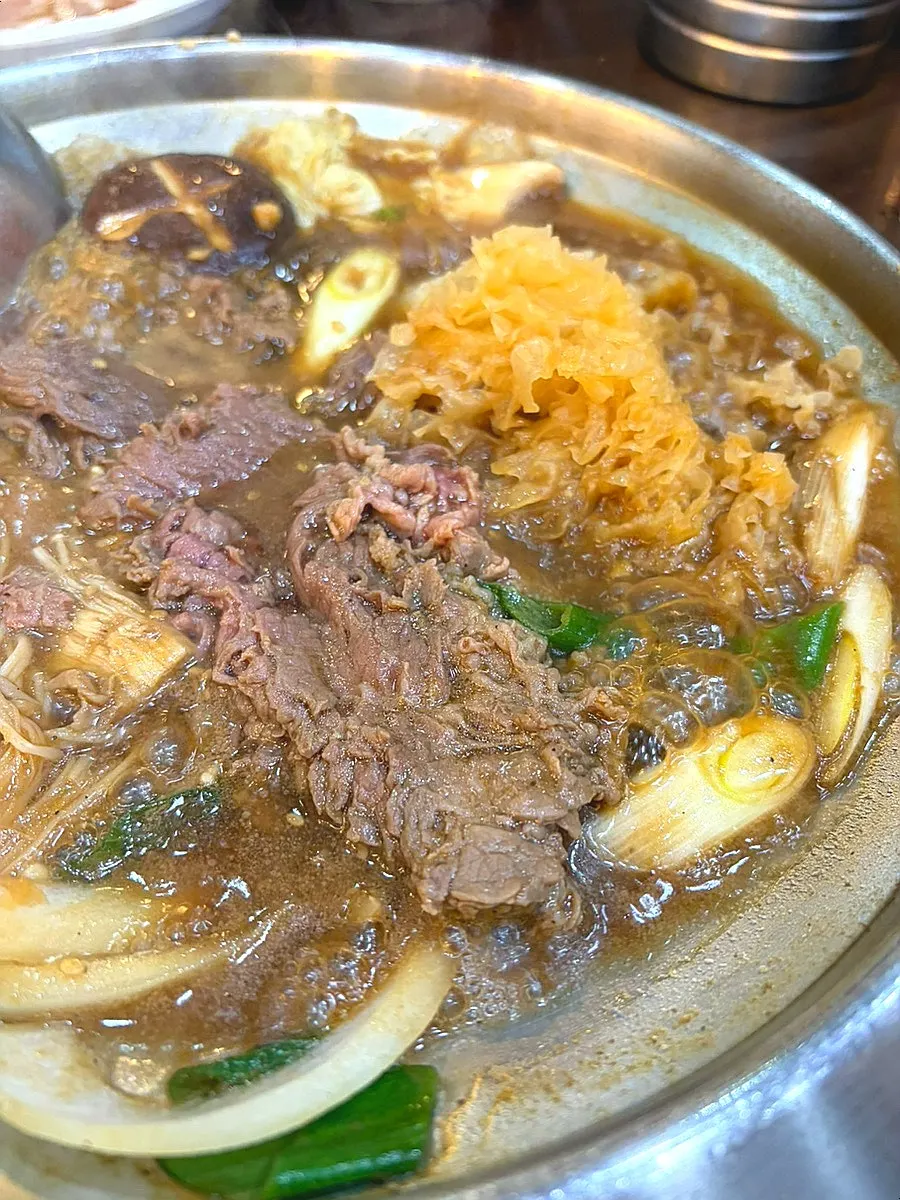Single-serving mushroom bulgogi hot pot packed with mushrooms, glass noodles, and meat