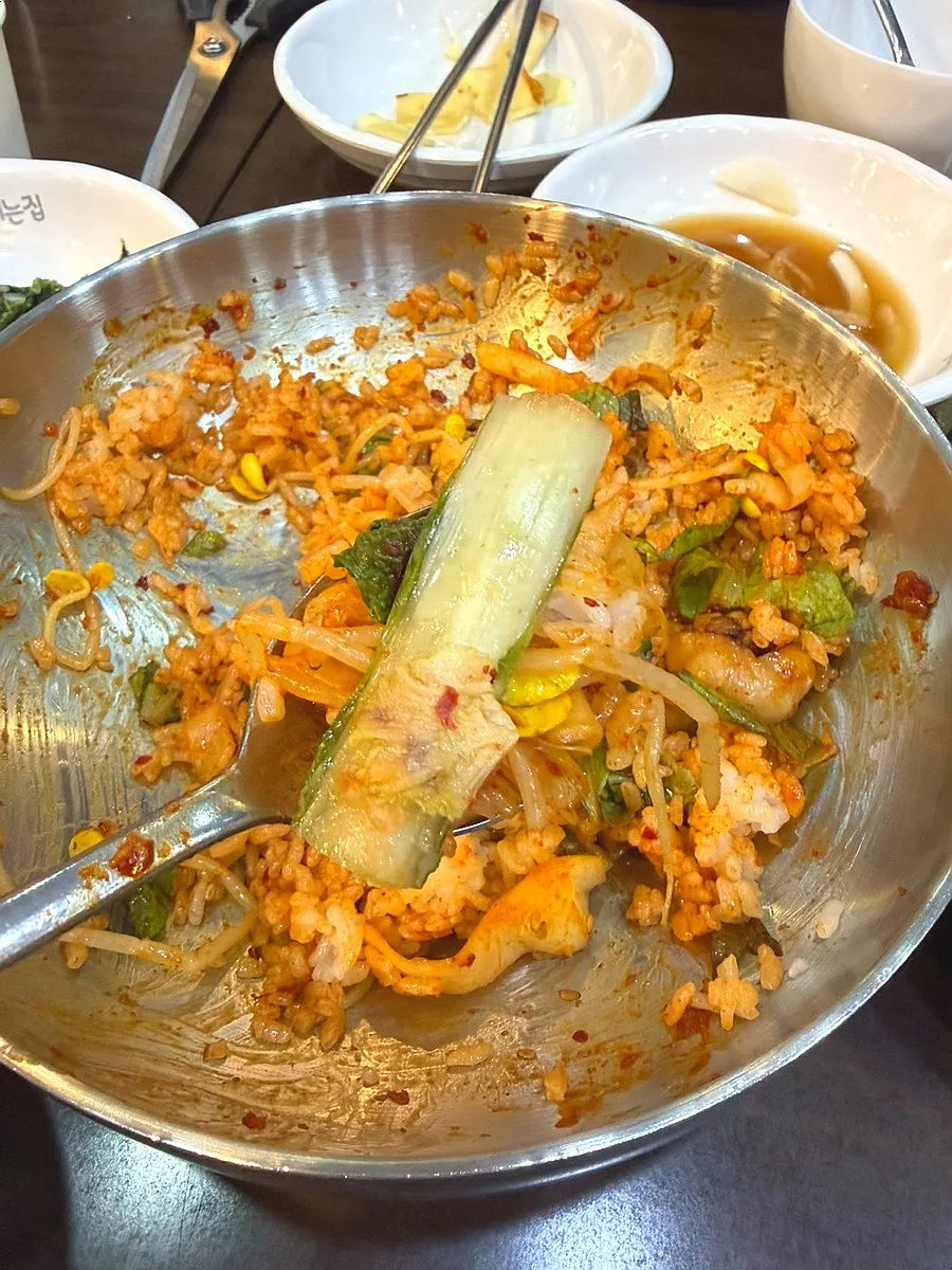 Rice and jjukkumi piled into a large bowl