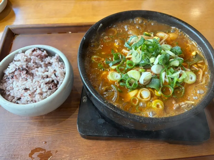 Boksan haejangguk served bubbling in a hot stone pot