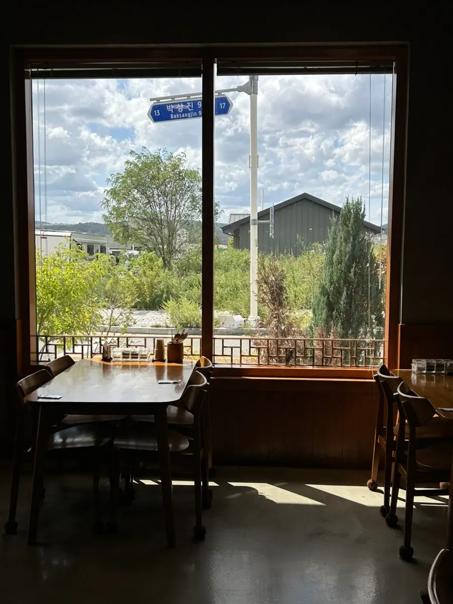 Dining hall with large windows at Boksan Haejang