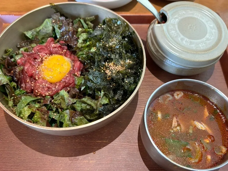 Yukhoe bibimbap piled high with raw beef