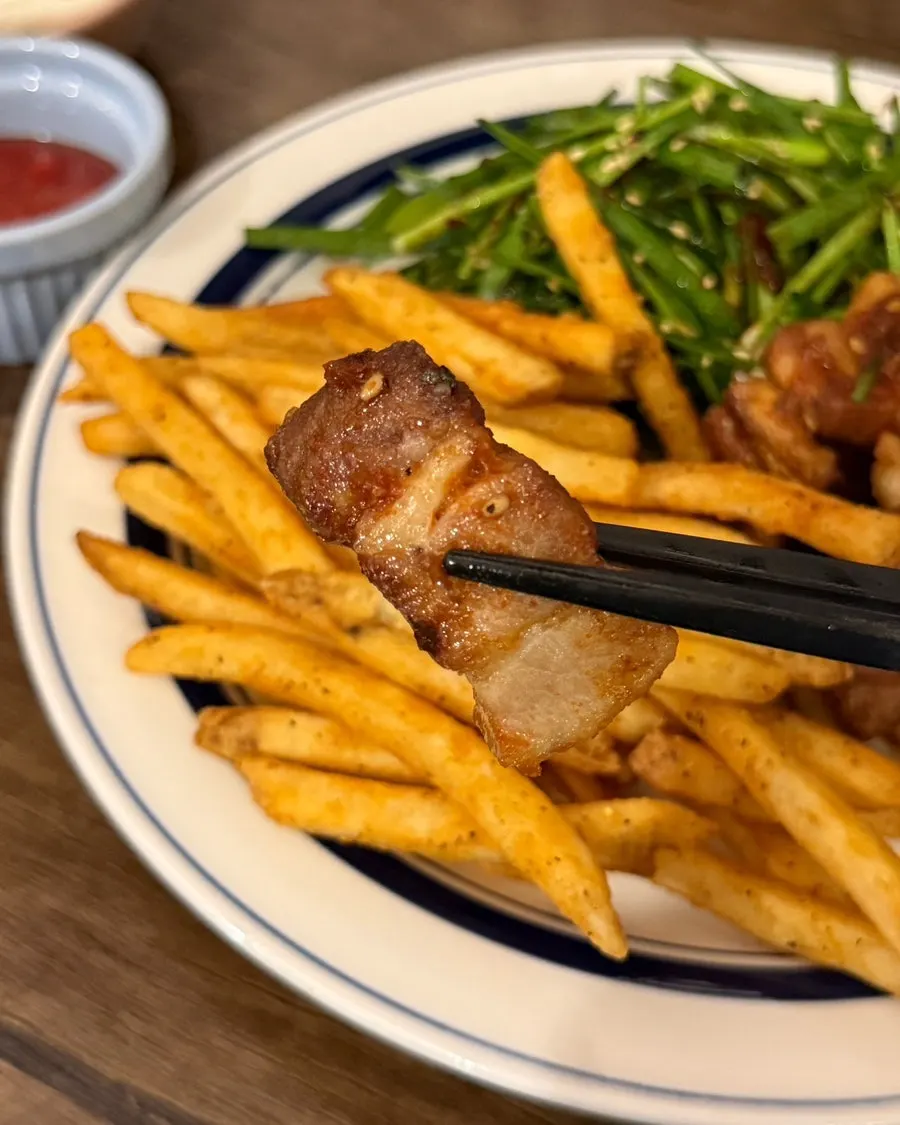 Crispy grilled pork belly with a smoky char