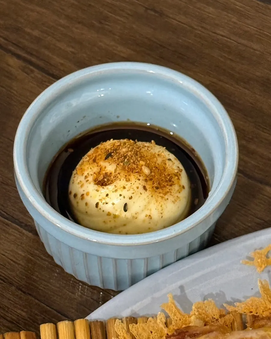 Cheese potato pancake dipped in soy sauce and mayonnaise