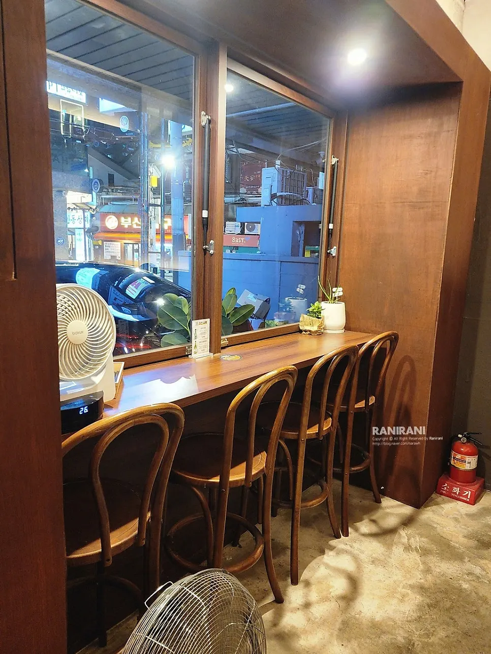 Interior with soft lighting, giving a late-night diner feel