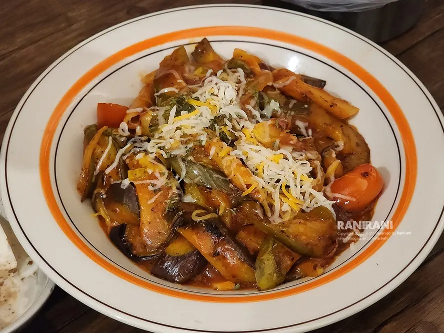 Tomato eggplant stir-fry with penne in tomato sauce