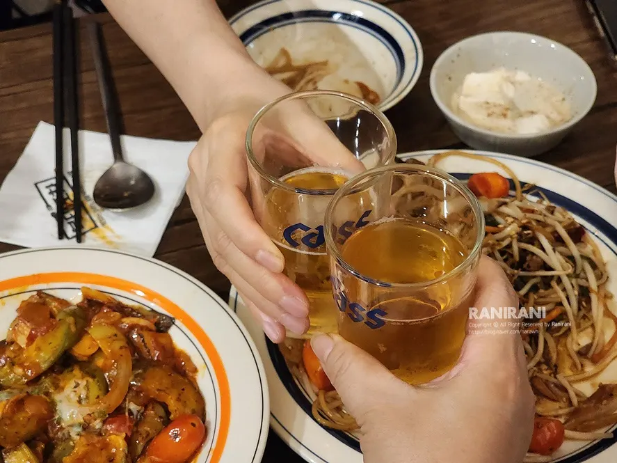 Clam soup and tomato eggplant stir-fry together on the table