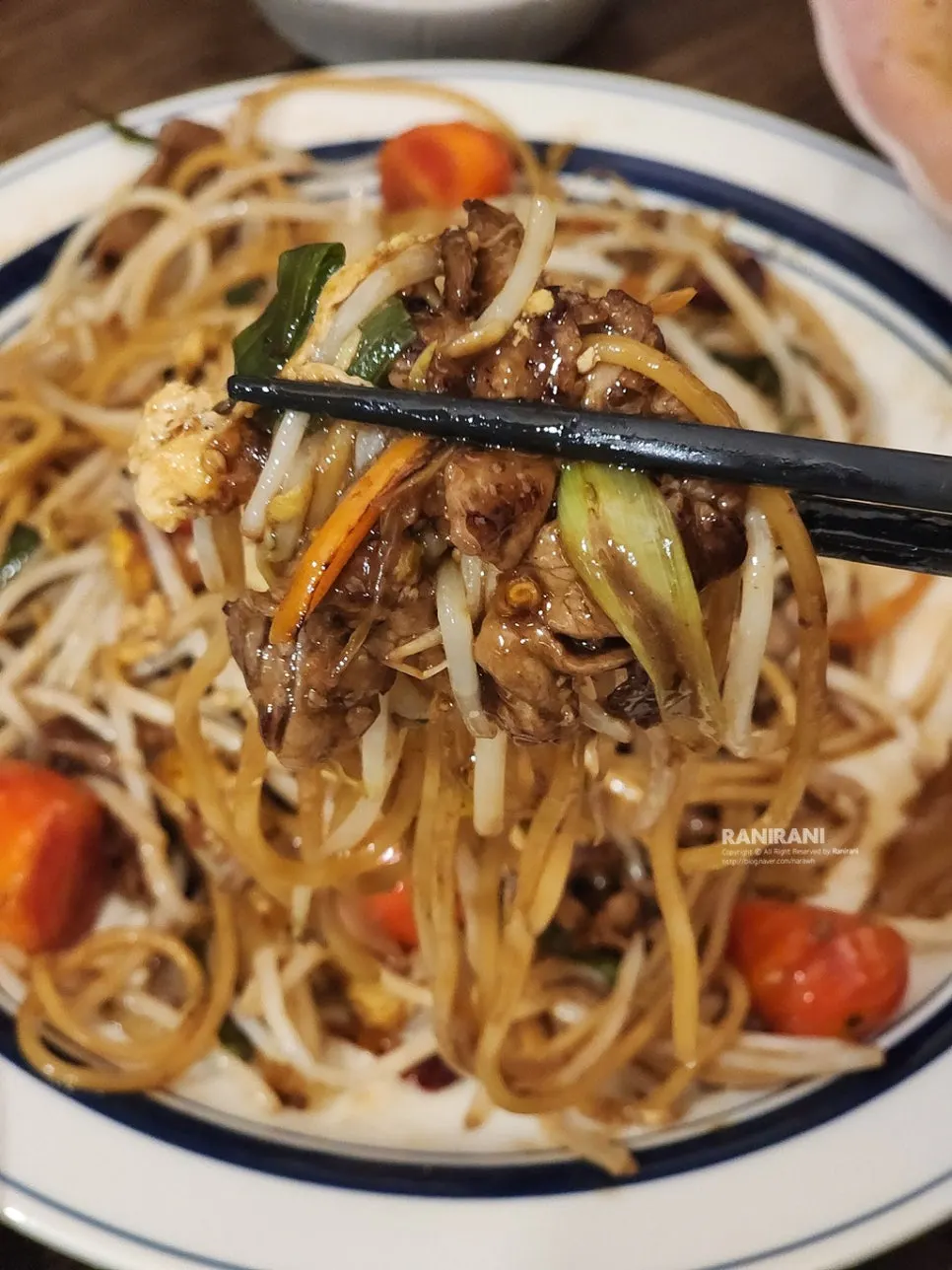 Beef brisket bean sprout noodles served with beer