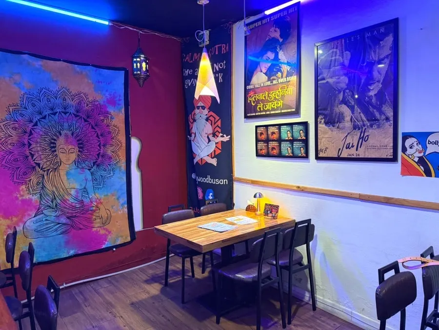 Seating area decorated with colorful fabrics