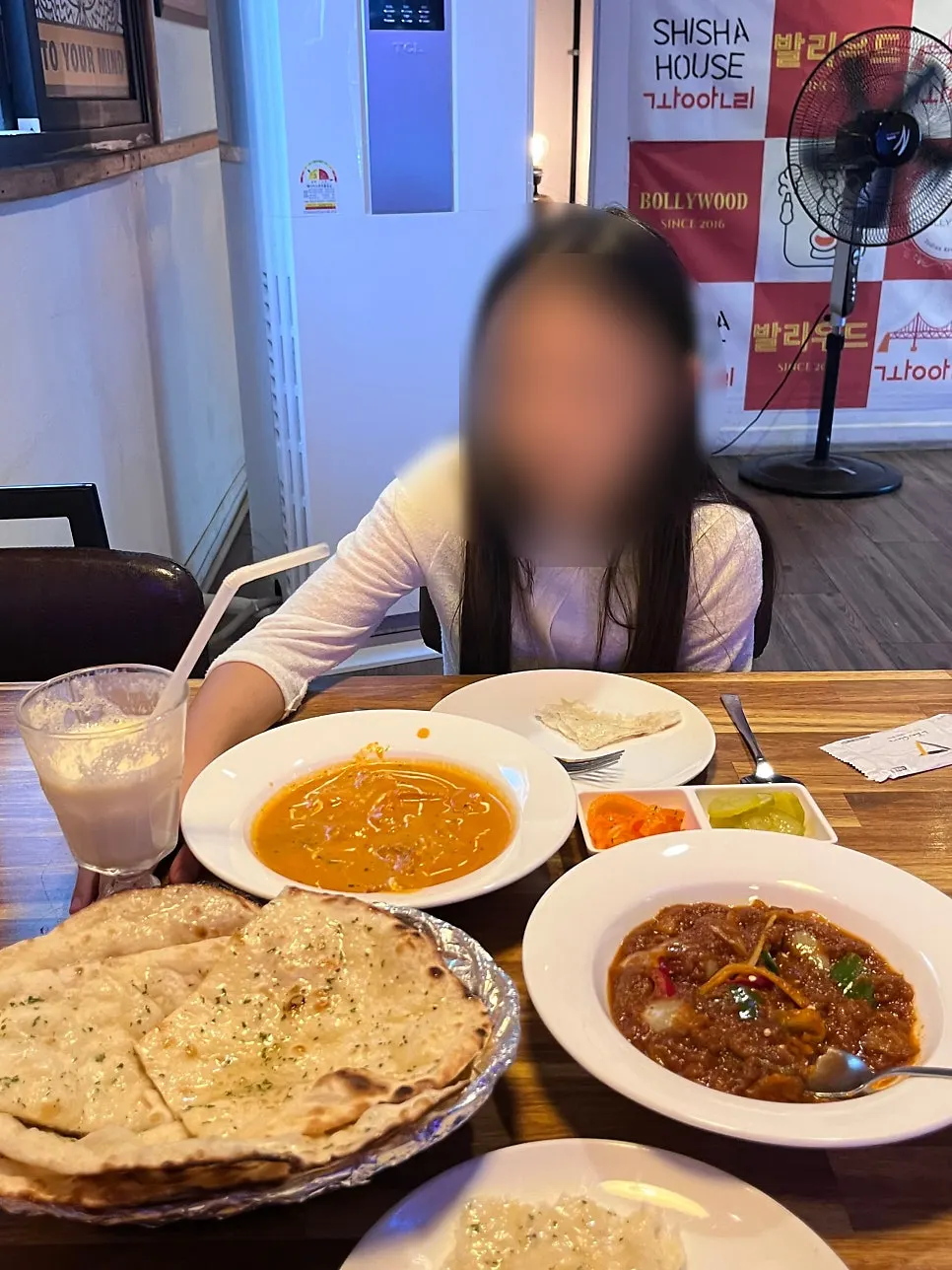 A bite of spicy lamb curry wrapped in naan