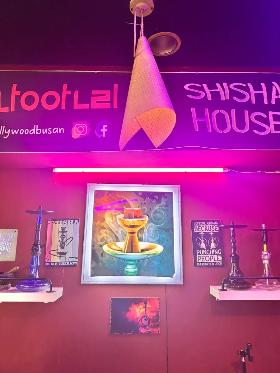 Wall filled with Indian-style posters and props