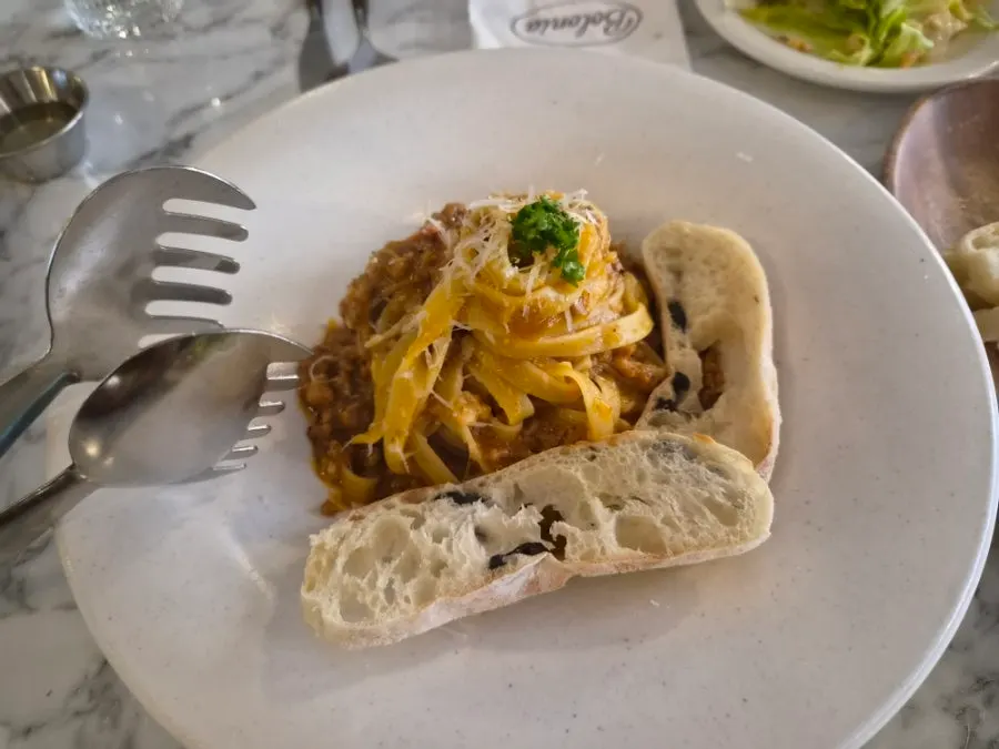 Bolognese ragu pasta served with olive ciabatta