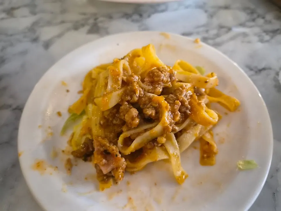 Fettuccine ragu pasta coiled in a deep bowl