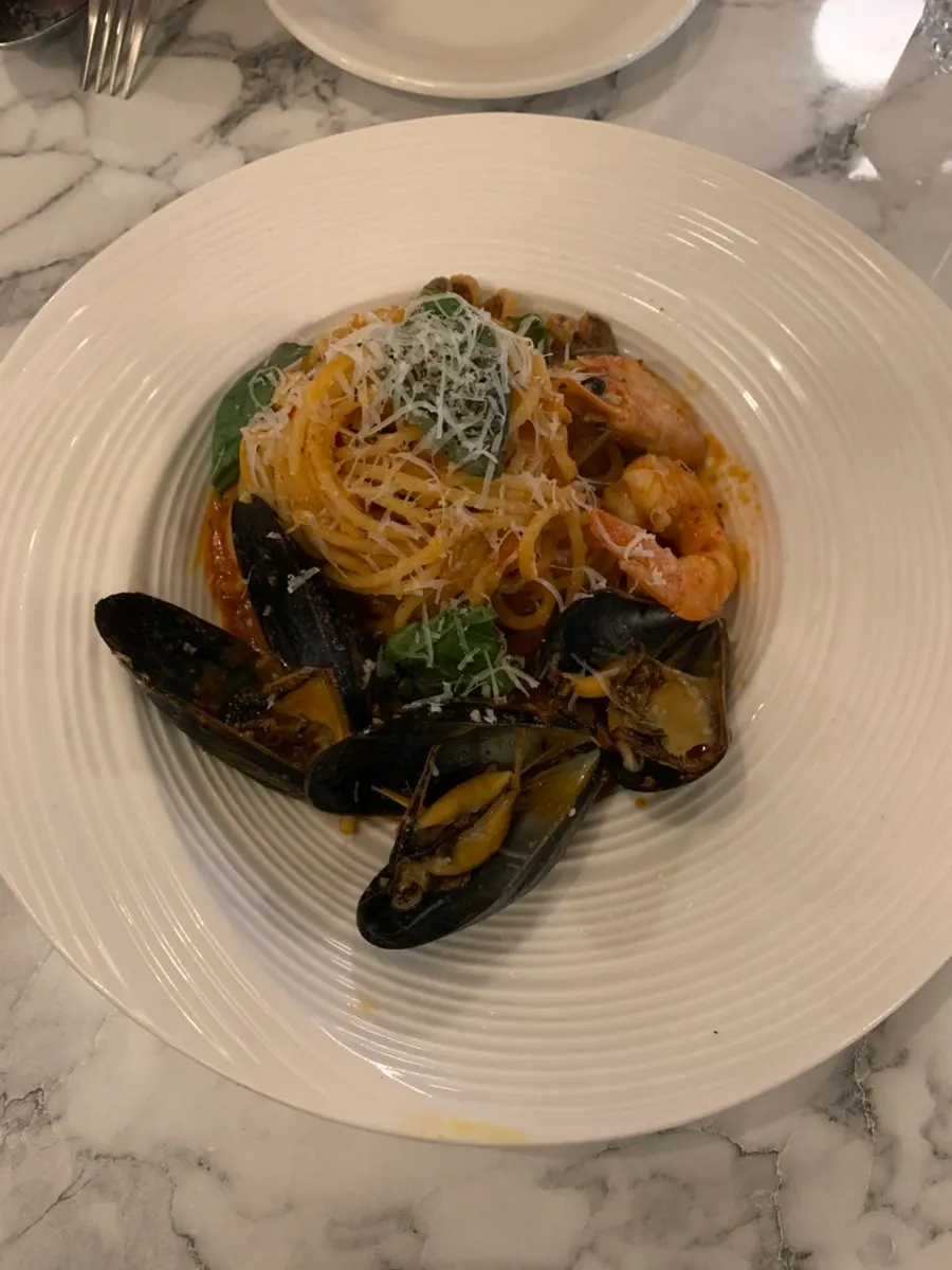 Spicy Mare pasta topped with grated cheese