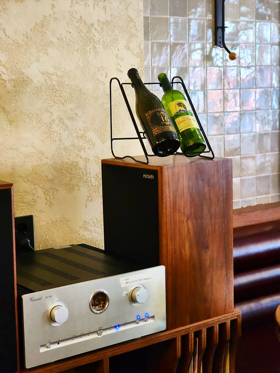 Wall with wine selection and speakers