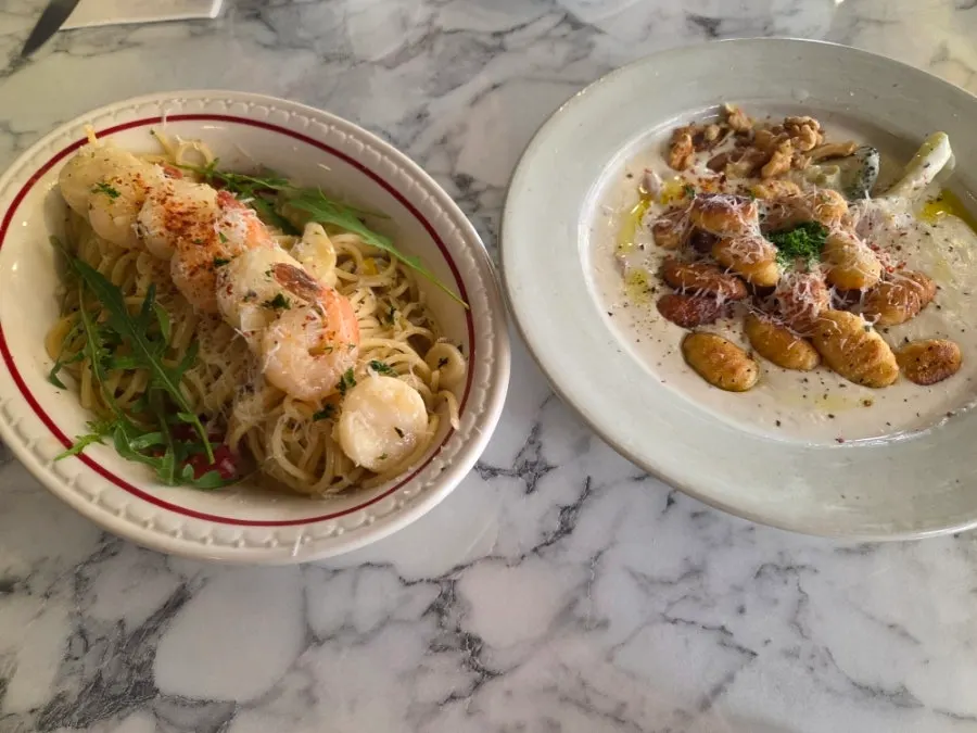 Aglio olio noodles topped with shrimp and scallops