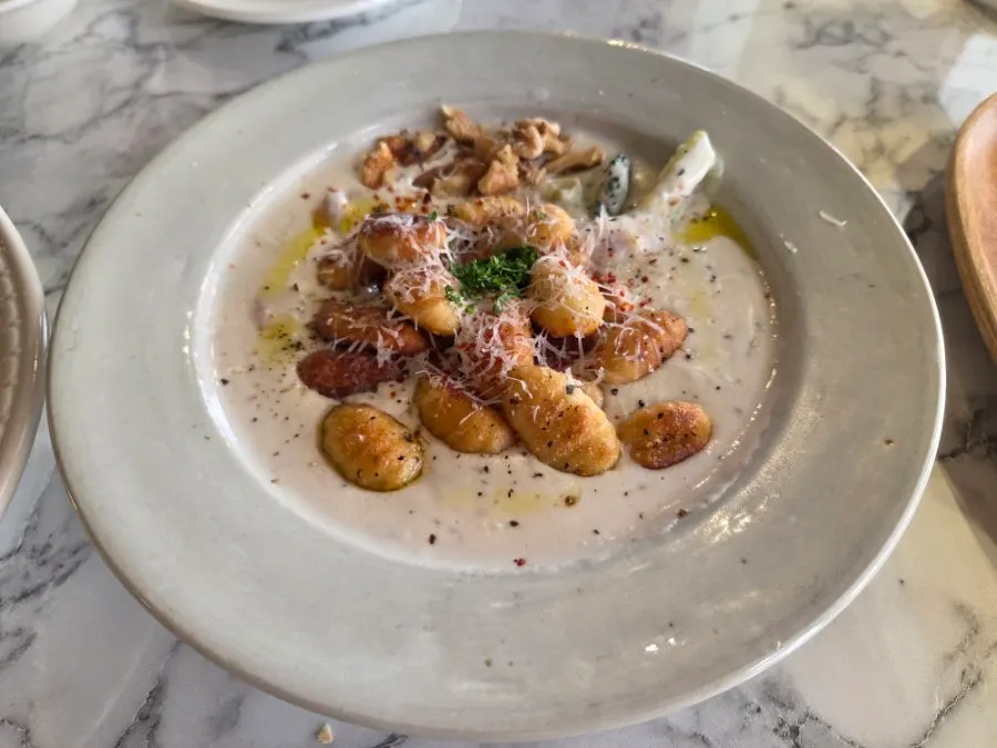 Table spread with truffle cream gnocchi and pasta