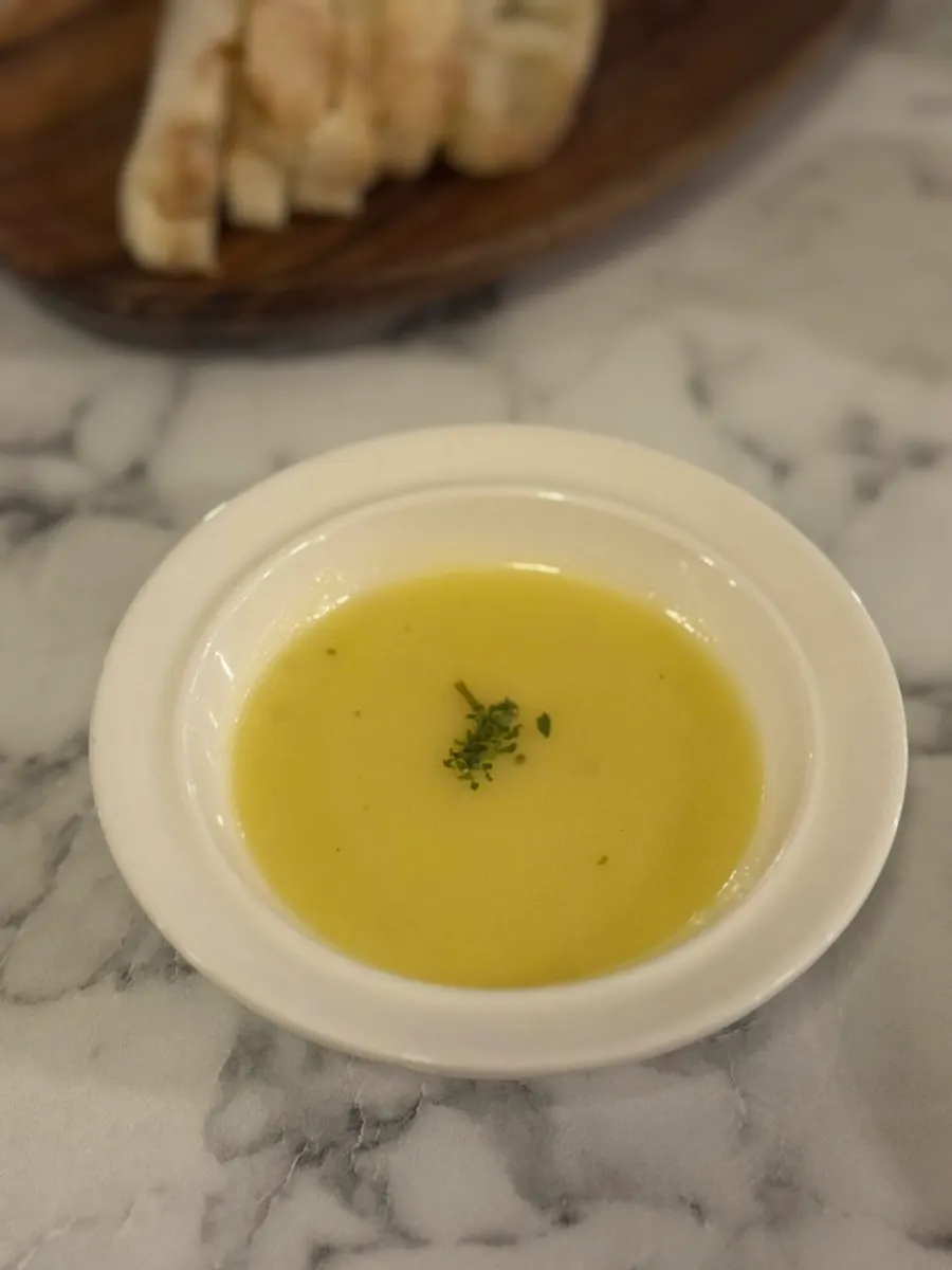 Starter corn soup with pickles and bread