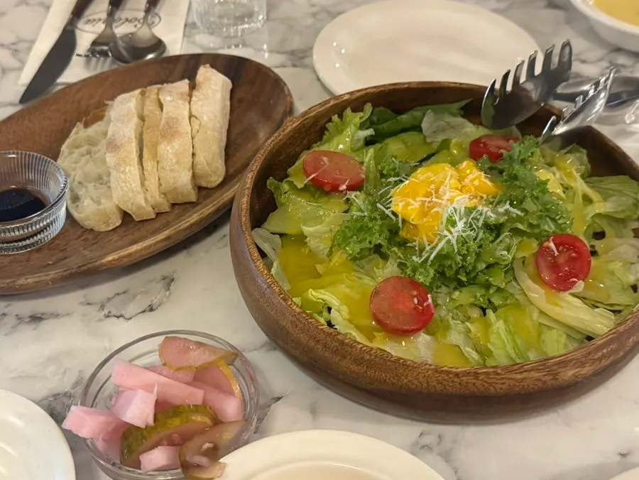 Seasonal salad topped with mango