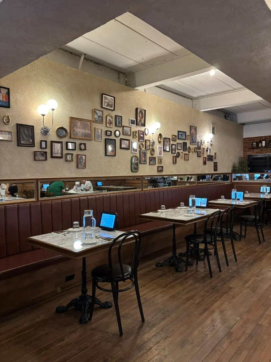 Spacious dining hall with wood-tone marble interior