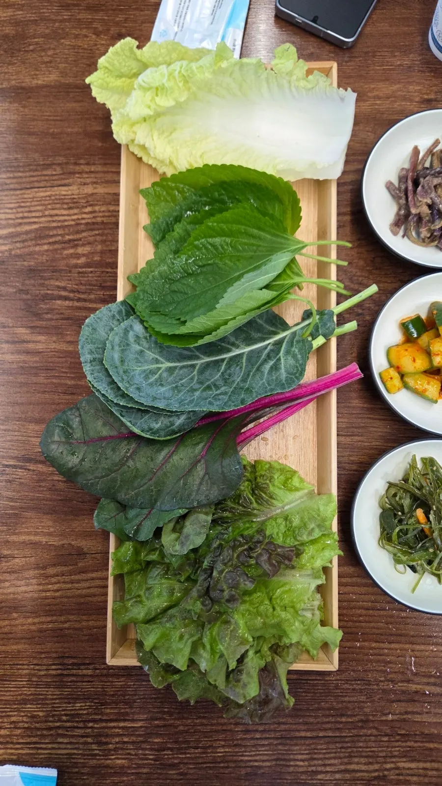 Lettuce, kale, perilla leaves and other ssam greens with chili and garlic