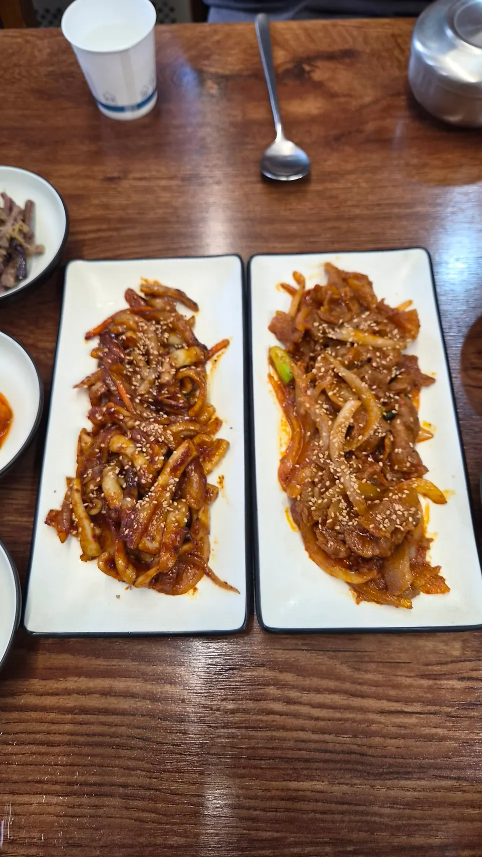 Squid stir-fry and pork stir-fry placed side by side