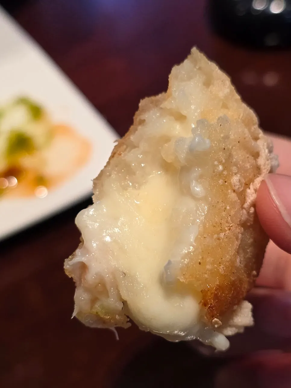 Stretchy cheese inside the potato cheese fritter