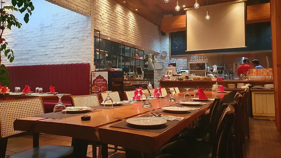 Interior with floor-to-ceiling windows and wood table