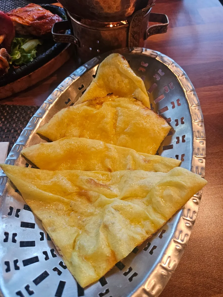Close-up of golden-baked garlic naan