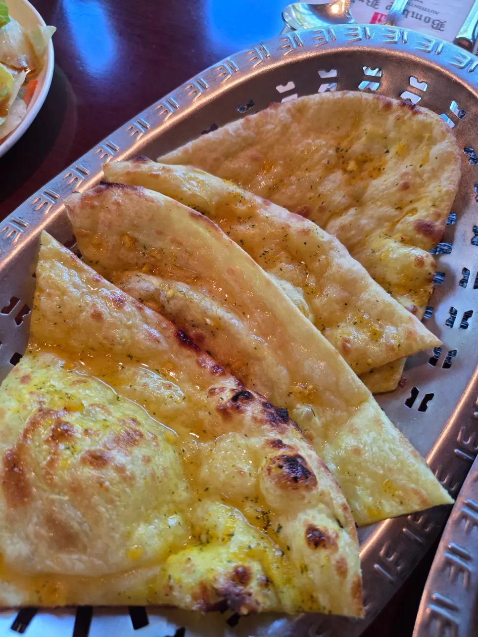 Dipping naan into the curry
