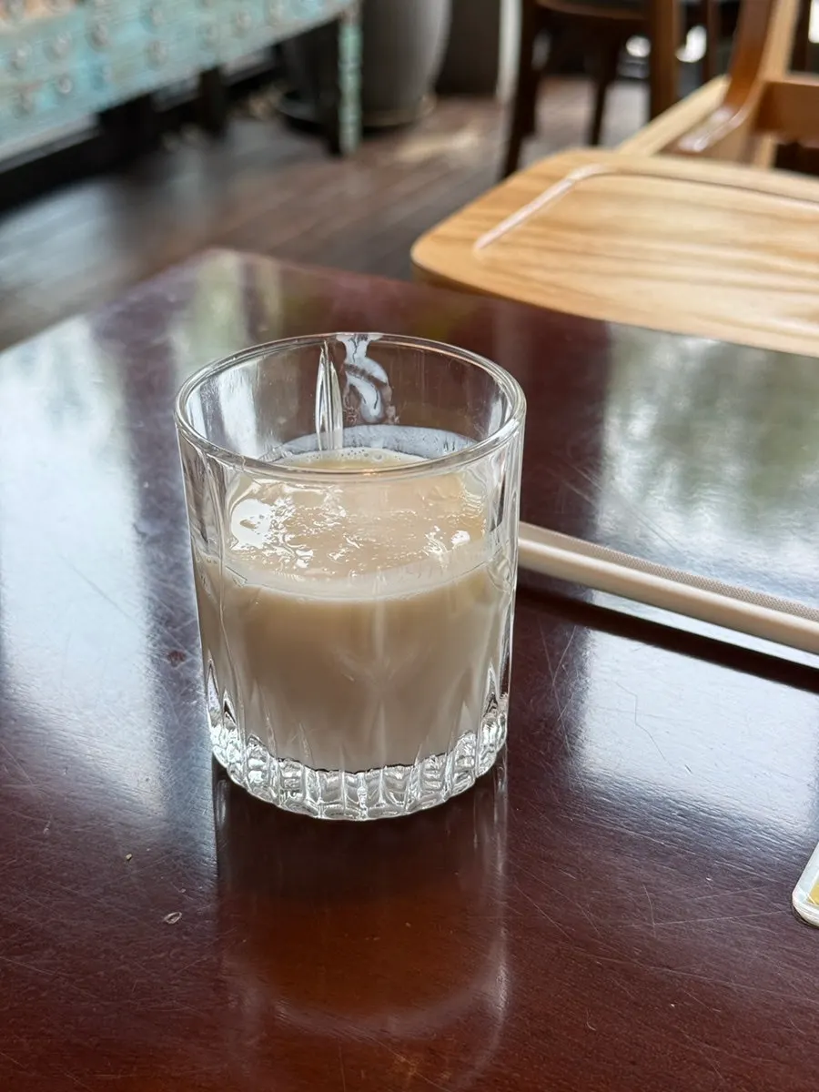 A taste of plain lassi served on the side