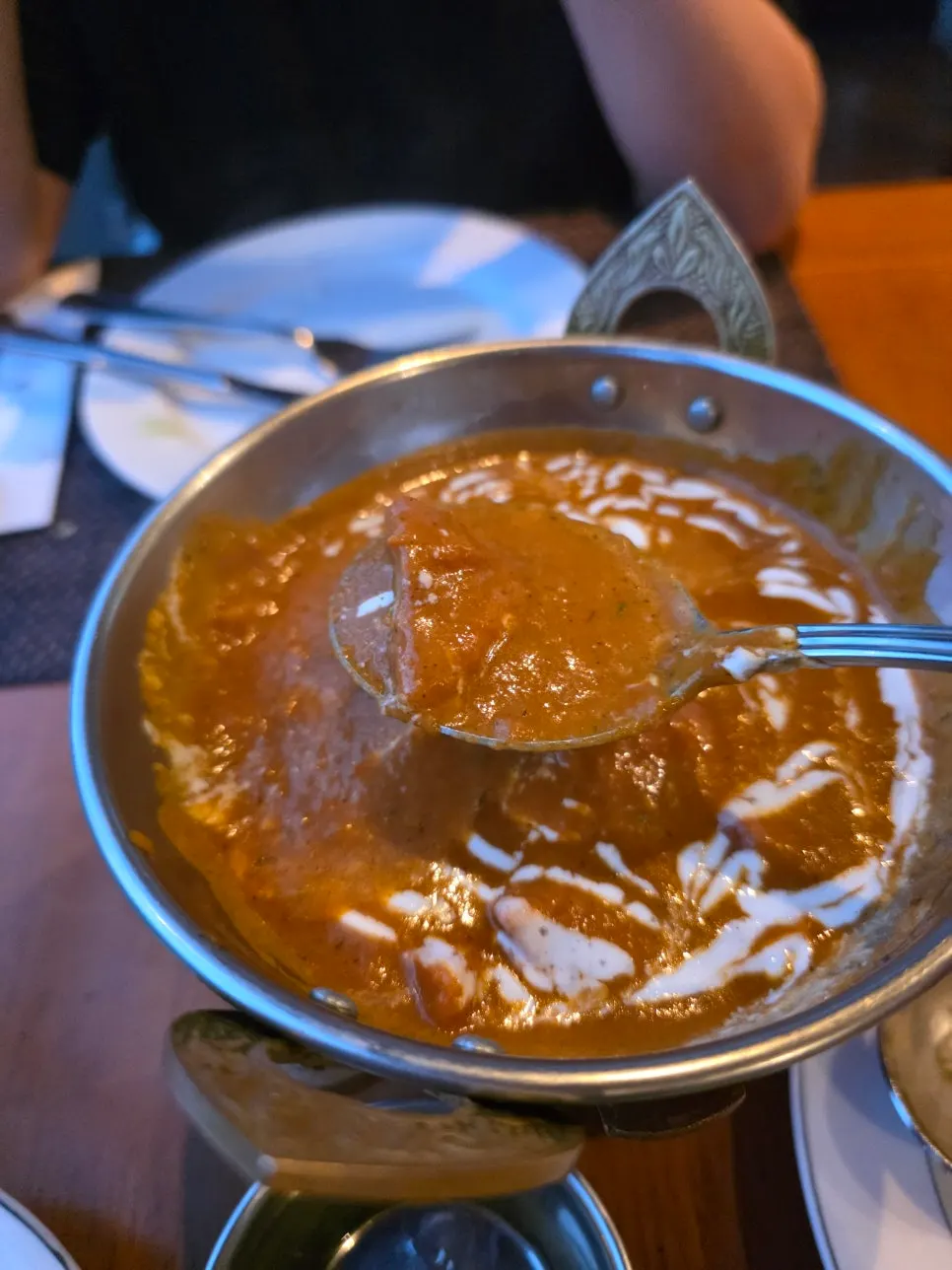 Chicken tikka masala served together with butter naan