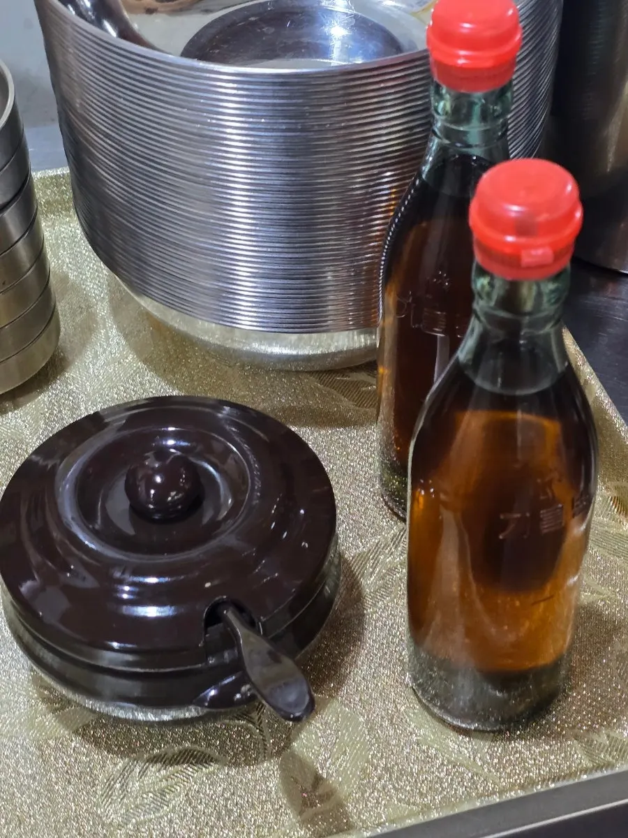 Gochujang and sesame oil placed next to the barley rice