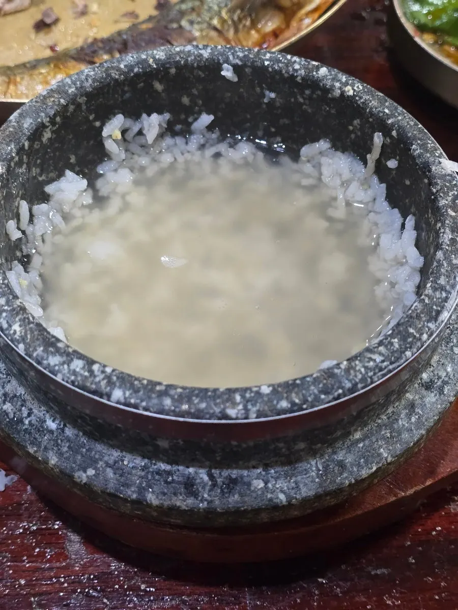 Stone-pot rice neatly scooped into a bowl