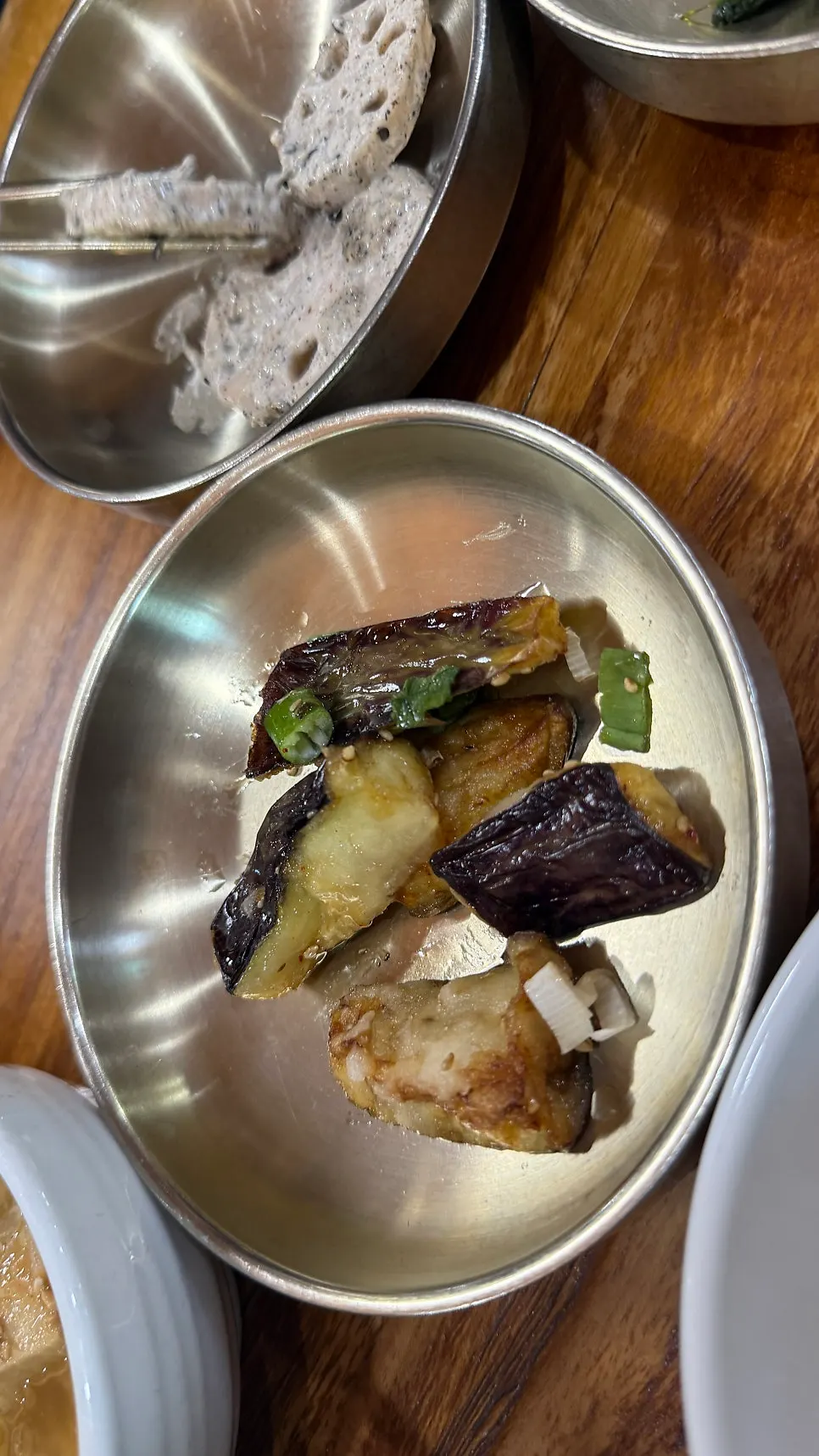 A variety of Korean banchan including japchae