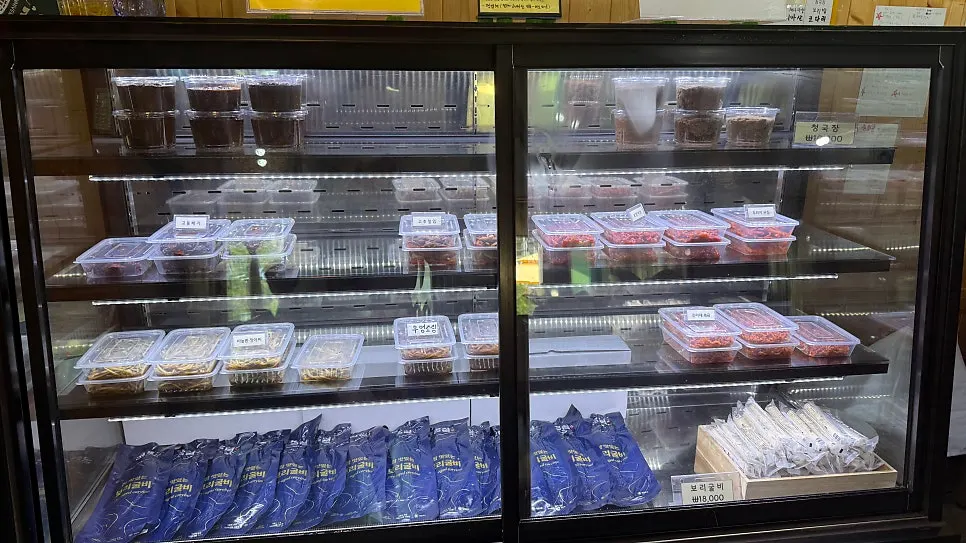 Display of packaged banchan for sale at Bomseol