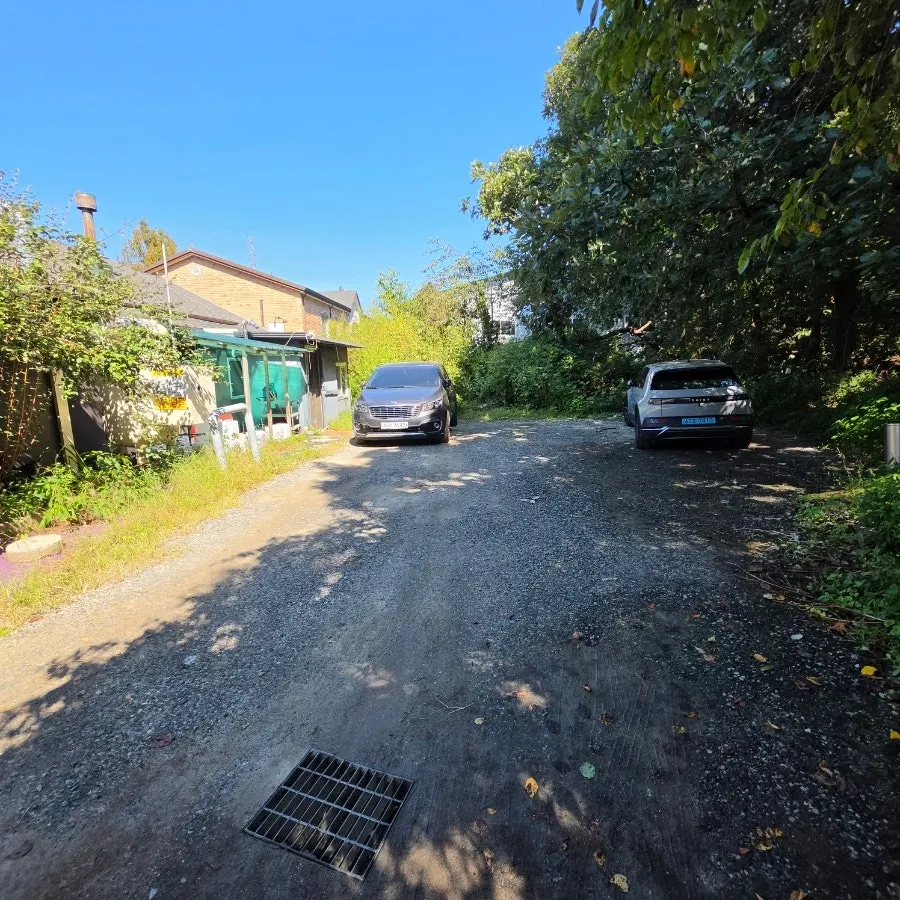 Bomseol's building and parking lot in a quiet spot near Gyeongan Stream