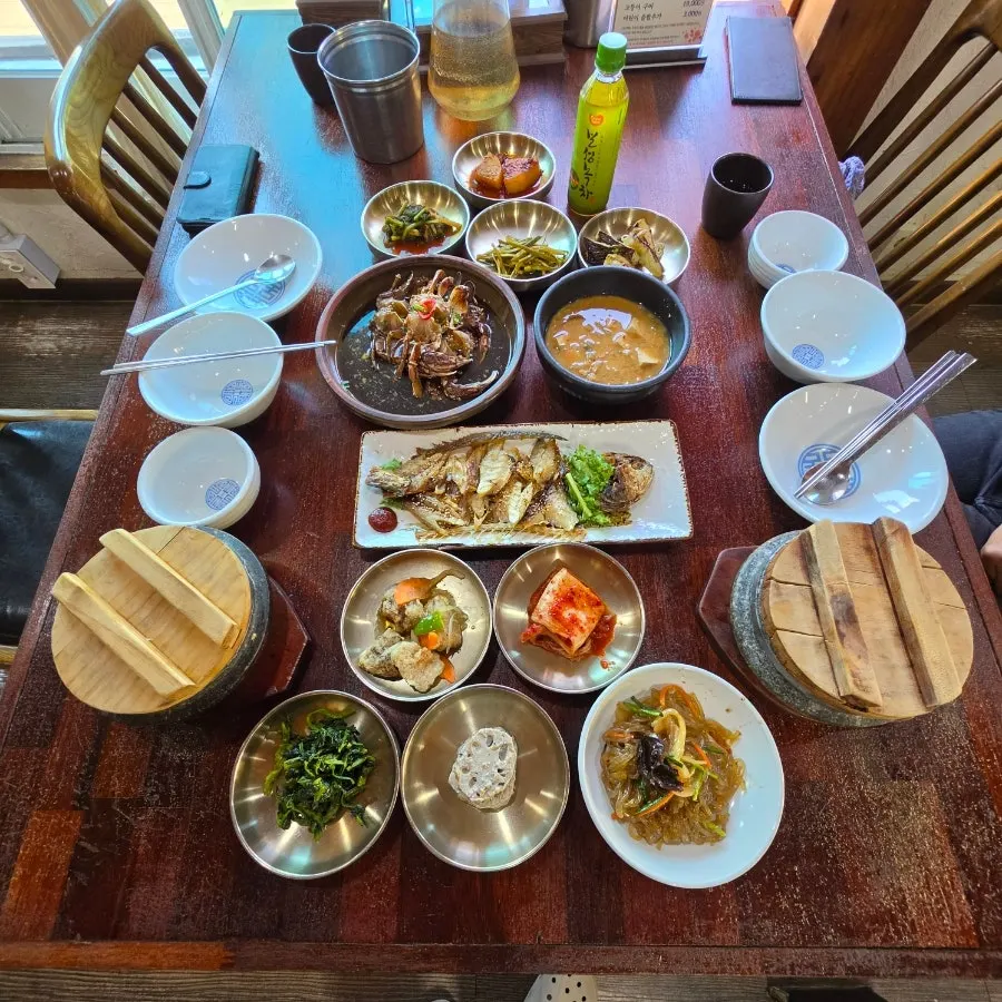 Soy marinated crab set and barley gulbi set table spread